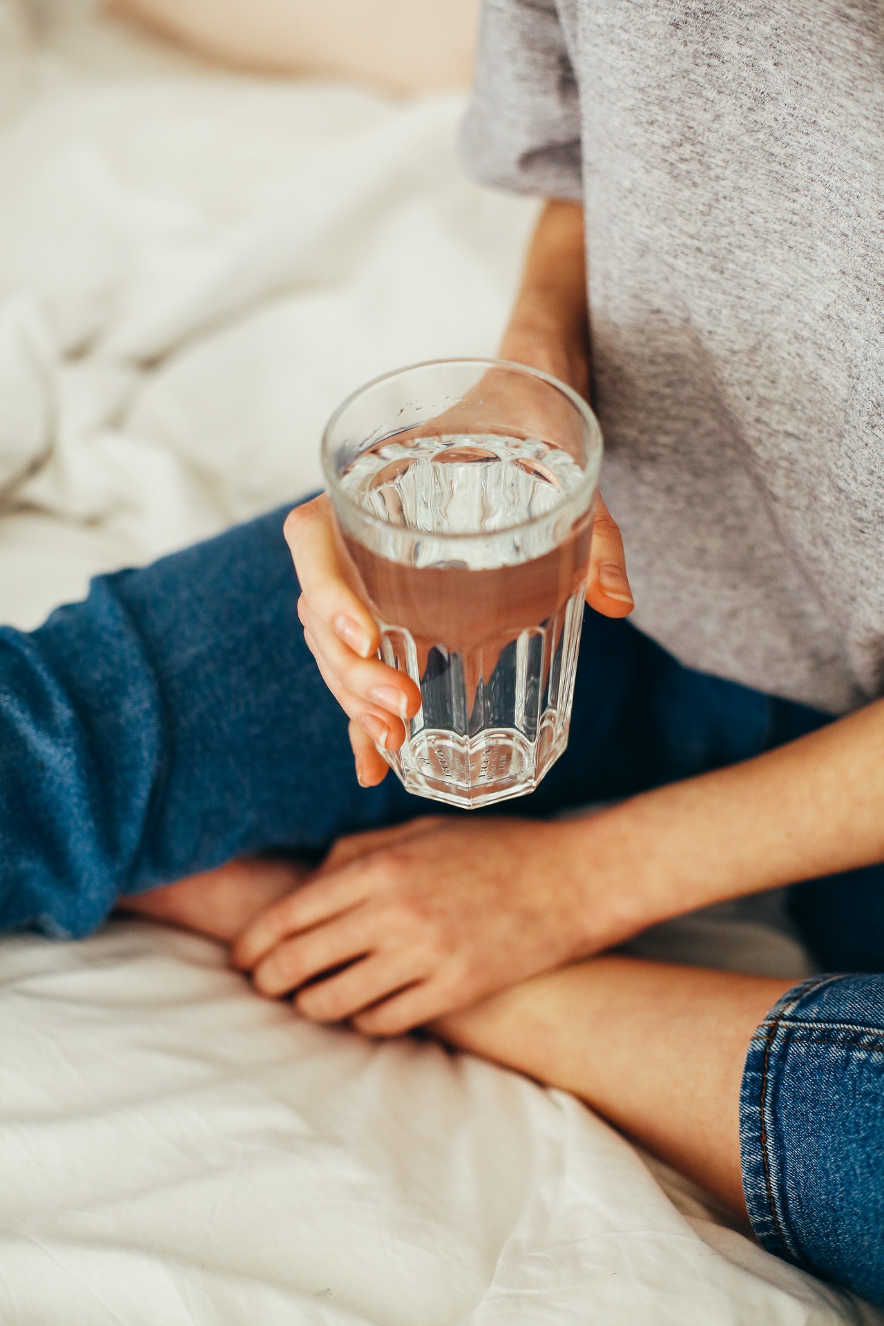 holding a glass of water