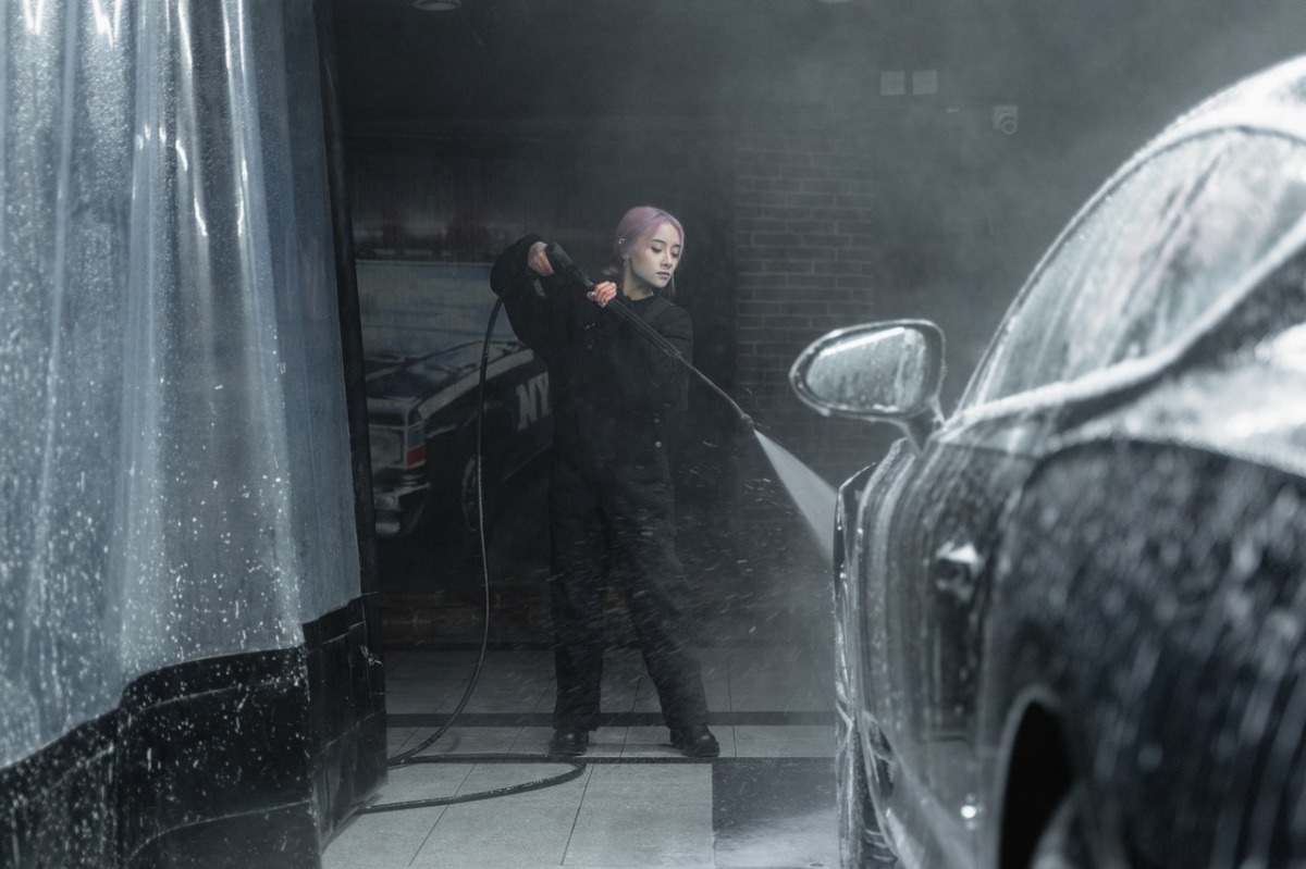 woman washing a car