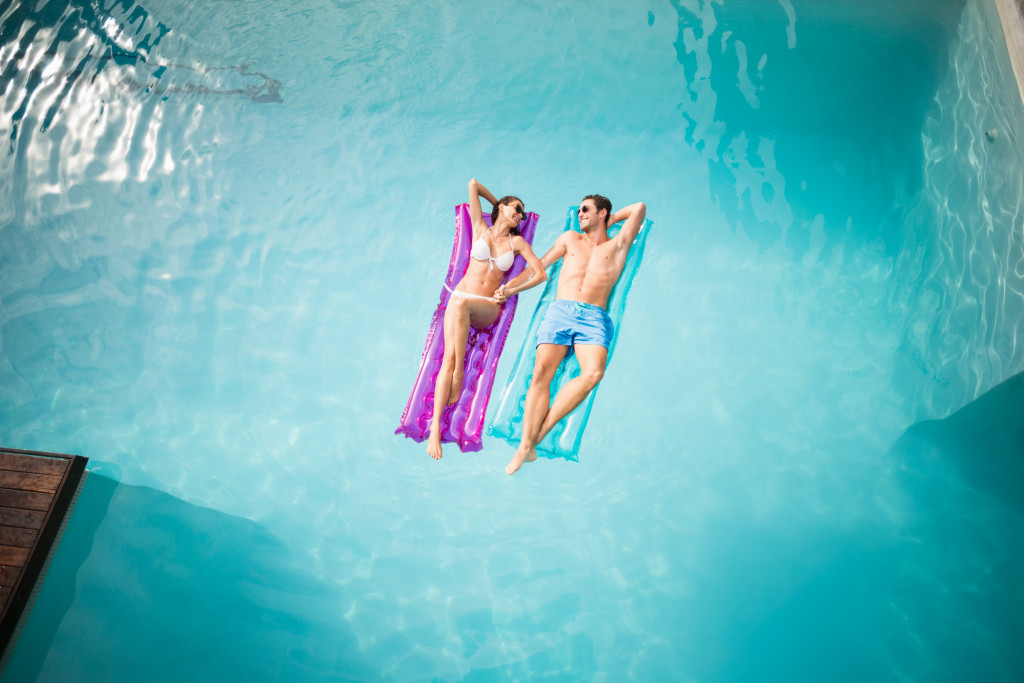 two people on a pool