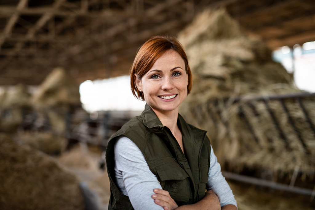 woman in a farm smiling