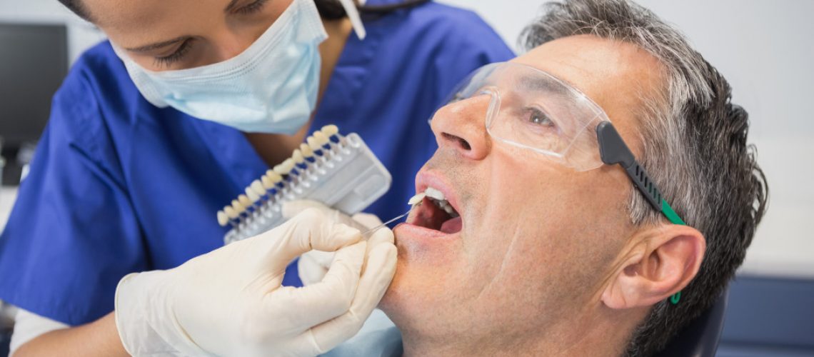man getting cosmetic dental surgery