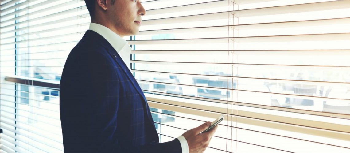 businessman looking out the window